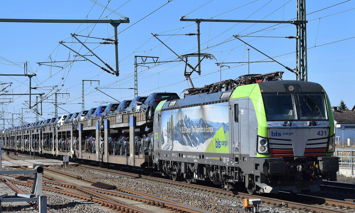 BLS Cargo AG, Bern [CH] mit ihrer Vectron  431  [NVR-Nummer: 91 85 4475 431-3 CH-BLSC] und einem PKW-Transportzug (fabrikneue LEXUS u.a andere Hybrid/Elektro-SUV) am 20.03.25 Höhe Bahnhof Rodleben.