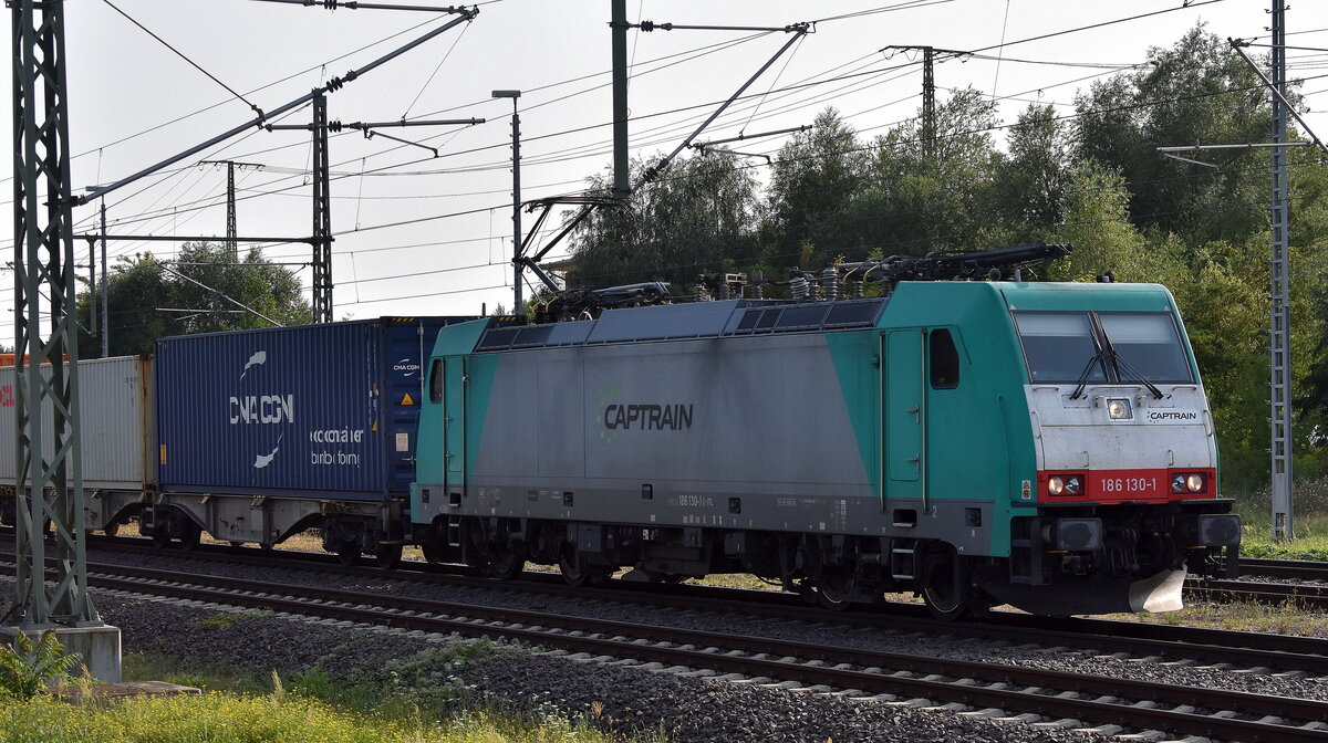Captrain Polska Sp. z o.o., Wrocław [PL] mit ihrer  186 130-1  [NVR-Nummer: 91 80 6186 130-1 D-ITL] und einem Containerzug am 09.08.25 Höhe Bahnhof Magdeburg Hbf.