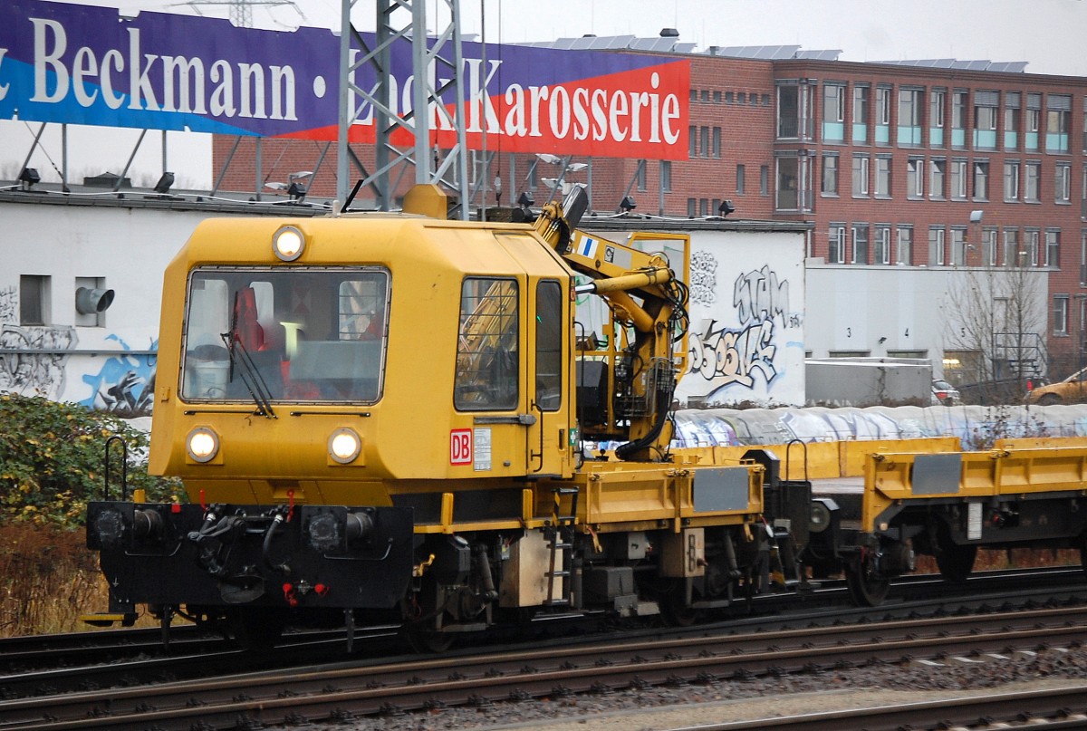 DB GAF 100 mit drei Flachhängern am 10.12.13 Berlin-Springpfuhl.