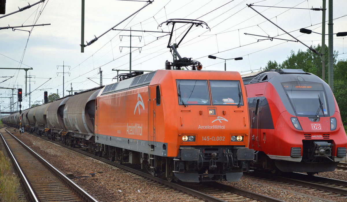 EKO Trans 145-CL 002 (145 082-4) mit einem Staubgutzug (Kohlestaub) am 11.07.16 Bf. Flughafen Berlin-Schönefeld.