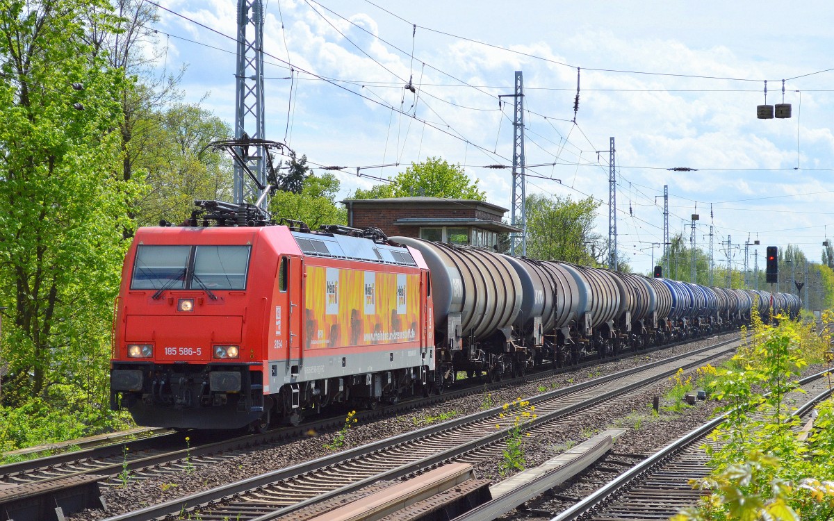 HGK/RHC 185 586-5 mit Kesselwagenzug am 04.05.15 Berlin-Karow.