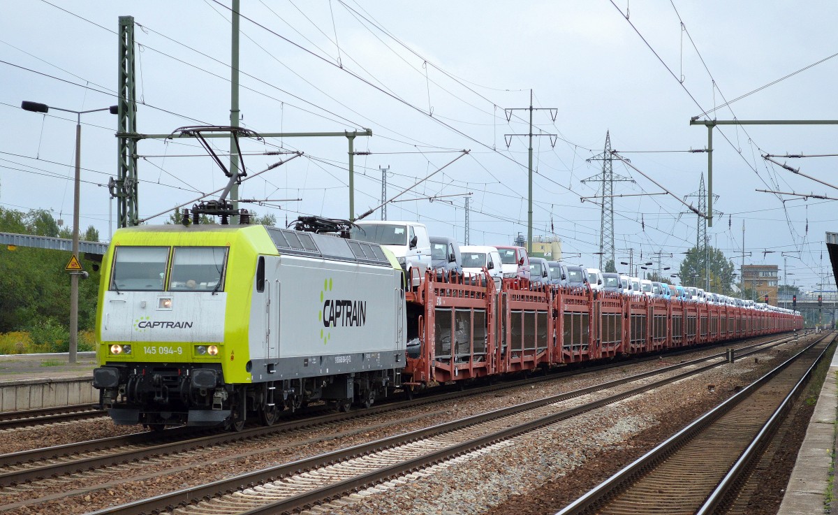 ITL/Captrain 145 094-9 mit PKW-Transportzug mit fabrikneuen VW Caddy + einigen VW Transportern am 11.09.14 Bhf. Flughafen Berlin-Schönefeld.