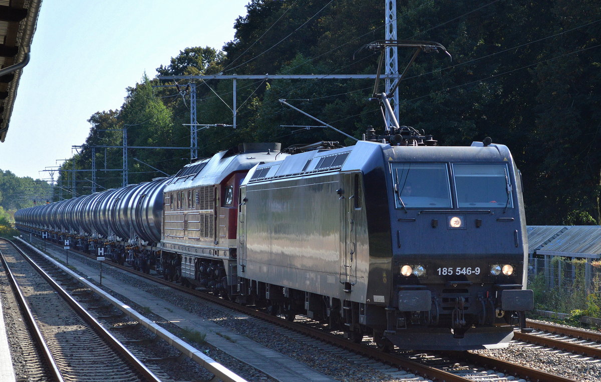 LEG mit der MRCE Mietlok 185 546-9 und einer ihrer 232ér + Kesselwagenzug am Haken am 07.09.16 Eichwalde bei Berlin Richtung Berlin-Grünau. 