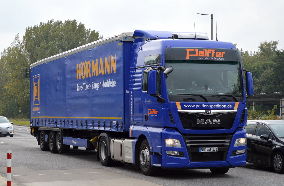 MAN TGX 18.460 Zugmaschine mit Auflieger der Internationalen Sped. Peiffer am 26.09.17 Berlin-Marzahn.