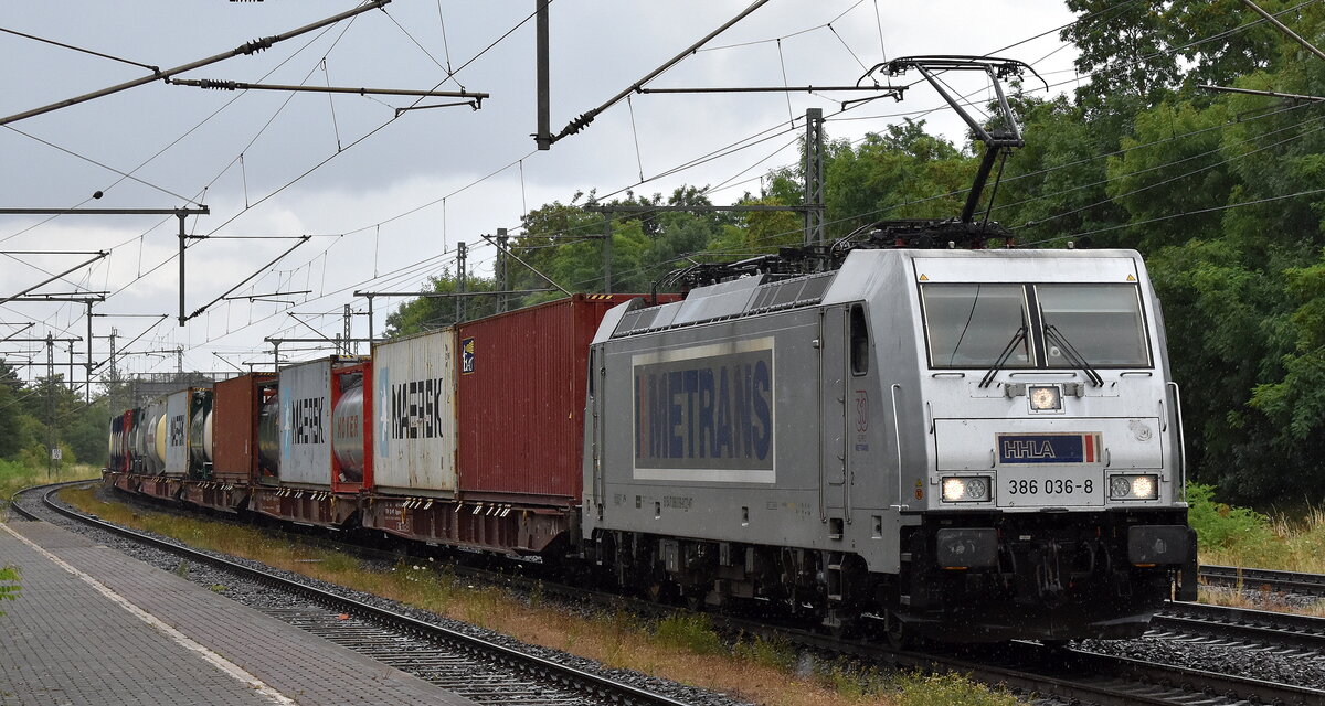 METRANS Rail s.r.o., Praha [CZ] mit ihrer  386 036-8  [NVR-Nummer: 91 54 7386 036-8 CZ-MT] und einem Containerzug am 07.07.25 Höhe Bahnhof Niederndodeleben.