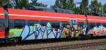 Graffiti an einem TALENT 2 der DB am 12.08.14 Bhf.