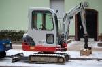 Ein Minibagger TAKEUCHI TB219, 15.01.13 Berlin-Pankow.