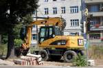 Ein CAT M313D (Leasingbagger) am 28.07.08 bei den Stra�enbauarbeiten in Berlin Wisbyer Str.