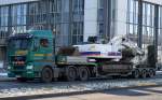 MAN TGX 26.480 mit Schwerlasttransport der Fa. DOMINIK mit einem EUROVIA Raupenbagger, einem HITACHI ZX 250-3  am 05.02.15 Schönefeld b.Berlin. 