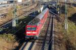 RE4 Richtung Wittenberge mit 112 121 (n�chster Halt Berlin-Jungfernheide), 25.11.11 Berlin-Putlitzbr�cke.
