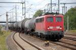 140 501-8 f�hrt mit Kesselwagenzug f�r eine l�ngere Pause im Bhf.