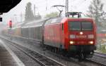 Gewitter �ber Berlin, bei sinflutartigem Regen f�hrt 140 007-1 mit Ganzzug SChiebewandwagen Richtung Innenstadt, 28.05.13 Berlin-Karow.