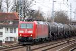 185 077-5 mit Kesselwagenzug Richtung Bernau, 31.03.11 Berlin-Karow.