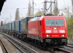 185 388-6 mit einem Ganzzug Taschenwagen Richtung Karower Kreuz Berlin Abzweig Richtung Oranienburg, 13.04.11 Berlin-Karow.