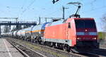 DB Cargo AG, Mainz [D]  152 033-7  [NVR-Nummer: 91 80 6152 033-7 D-DB und einem gemischten Kesselwagenzug am 27.03.25 Höhe Bahnhof Niederndodeleben.