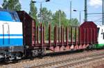 Drehgestellflachwagen f�r Holztransporte mit festen Stirnw�nden + Rungen Typ Sns der Fa.