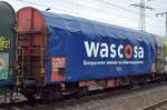 Drehgestell-Flachwagen mit vier Radsätzen, verschiebbarem Planenverdeck und Lademulden für Coil-/Spaltbandtransporte vom Einsteller WASCOSA AG mit niederländischer Registrierung mit der