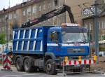 Hochwandiger MAN Kipper mit Hydraulikgreifarm der Fa.