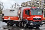 MAN TGX LKW mit Pritschenaufbau mit Planeüberzug der Fa.