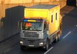 MAN Transportfahrzeug mit Hydraulikgreifarmaufsatz f�r Baustellenger�tschaften und Baustellencontainer der Fa.