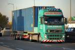 VOLVO FH mit Flachauflieger mit Container der Sped.COLOSSUS, 19.10.12 Berlin-Heinersdorf.