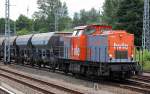 hvle V160.7 (203 150-8) mit einigen firmeneigenen Sch�ttgutwagen Richtung Nordosten, 27.06.13 Berlin-Springpfuhl.